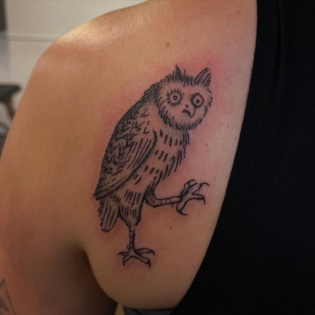Charming owl tattoo with a quirky design Tattoo Design