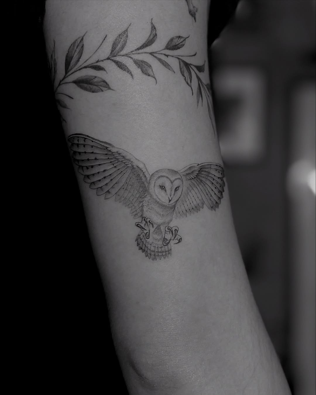Elegant black and white owl tattoo in flight Tattoo Design