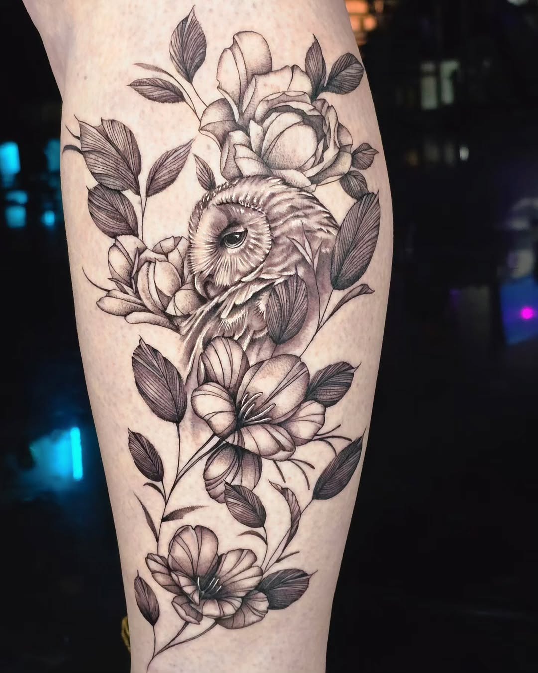 Elegant owl surrounded by delicate floral patterns Tattoo Design