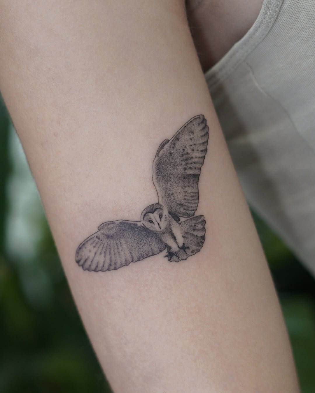 Elegant owl tattoo in flight showcases beauty Tattoo Design