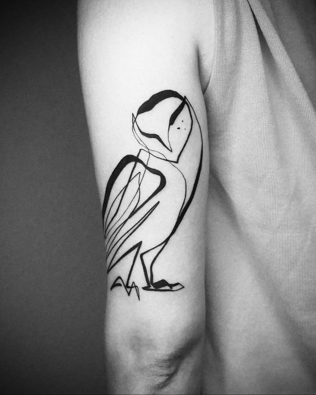 Minimalist owl tattoo in elegant line art Tattoo Design