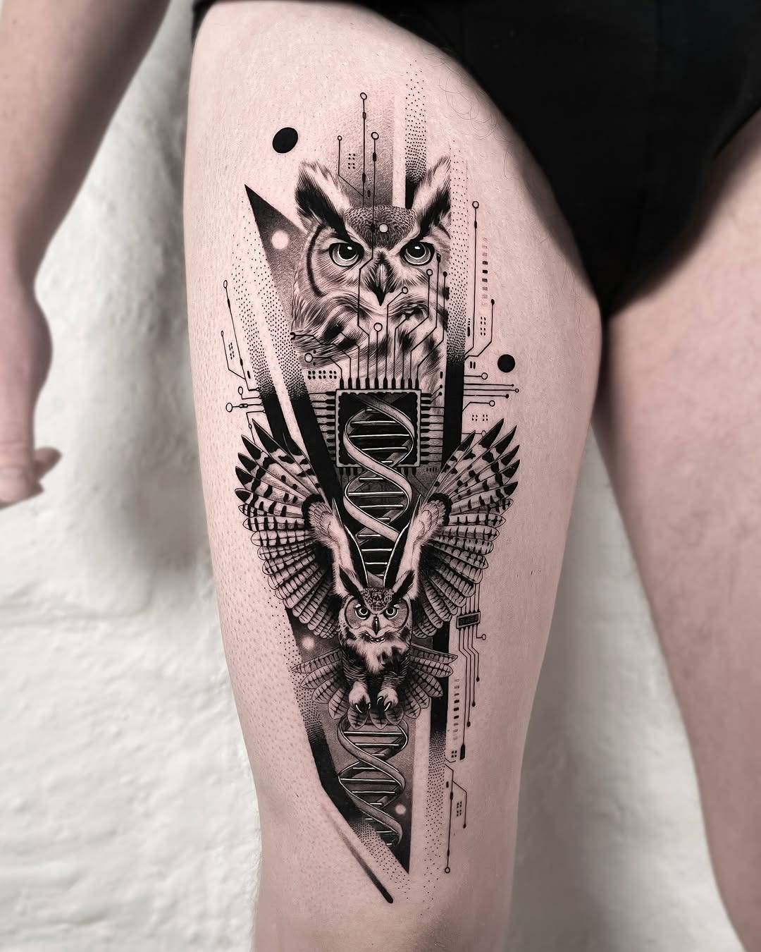 Striking geometric owl tattoo with dual imagery Tattoo Design