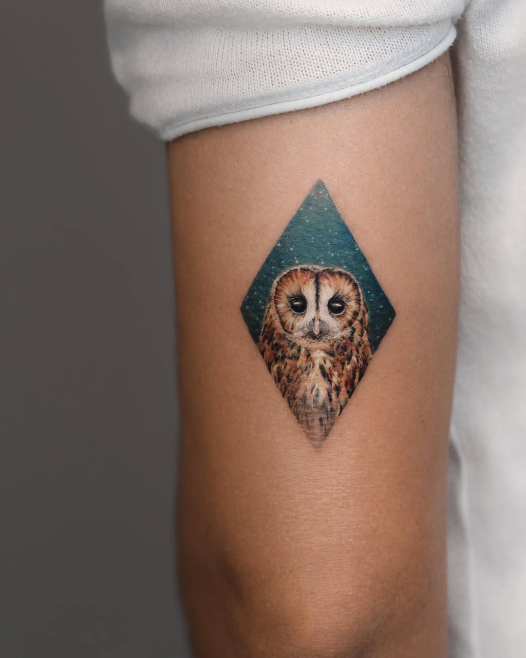 Unique owl tattoo in diamond-shaped design Tattoo Design