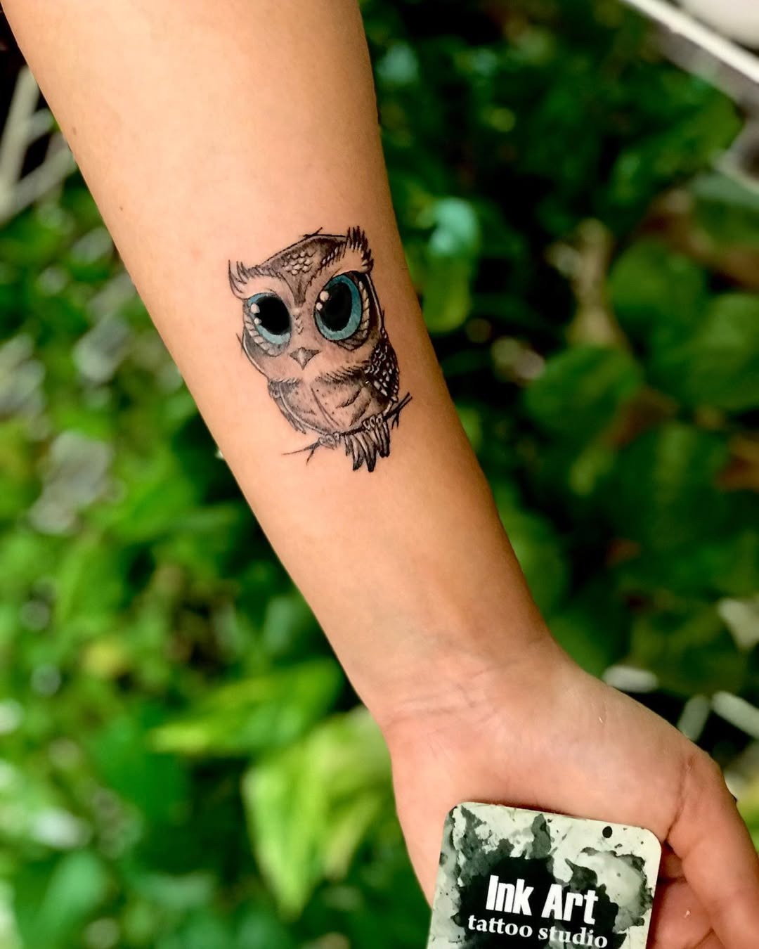 Whimsical owl tattoo with big expressive eyes Tattoo Design