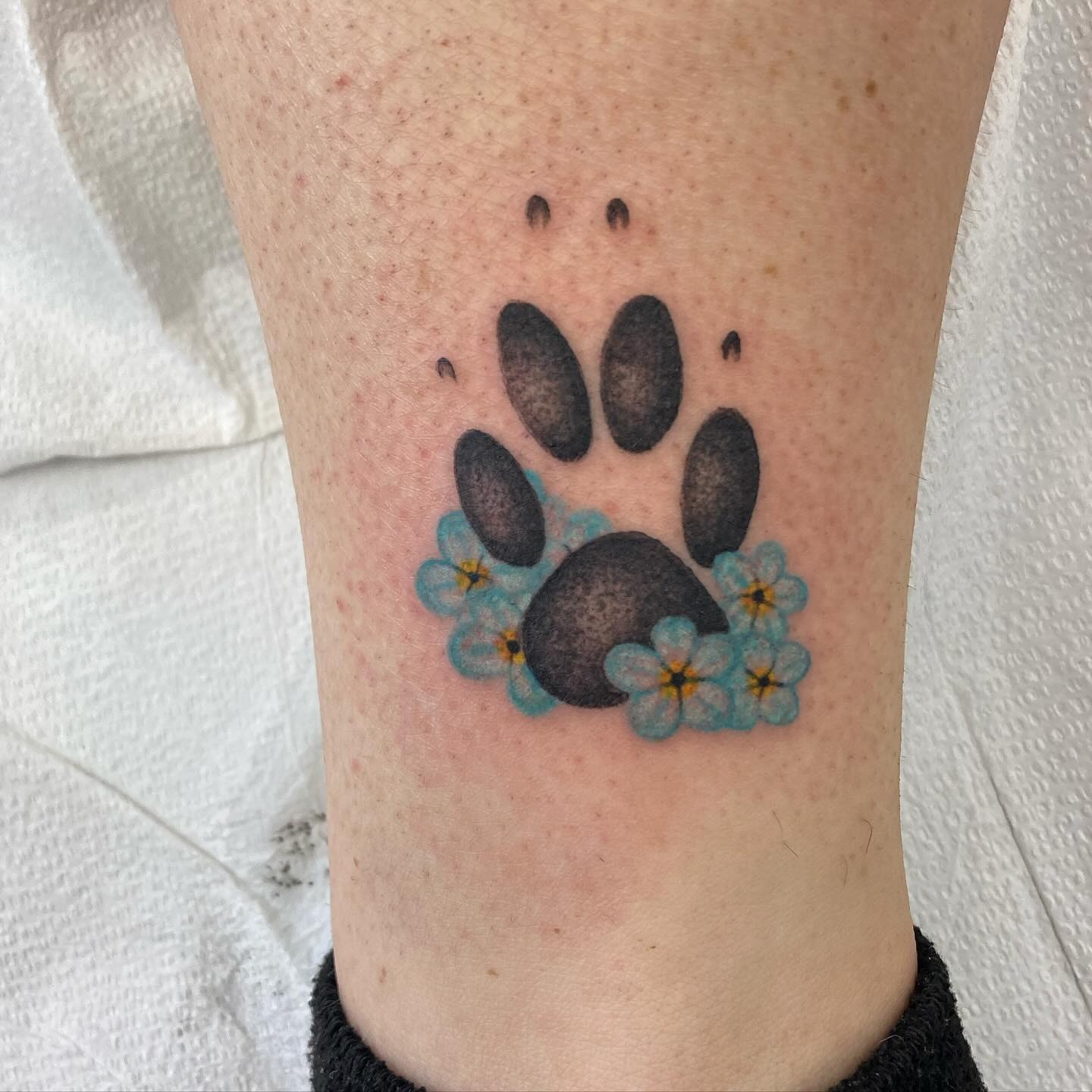 Paw Print Tattoo with Forget-Me-Nots Tattoo Design