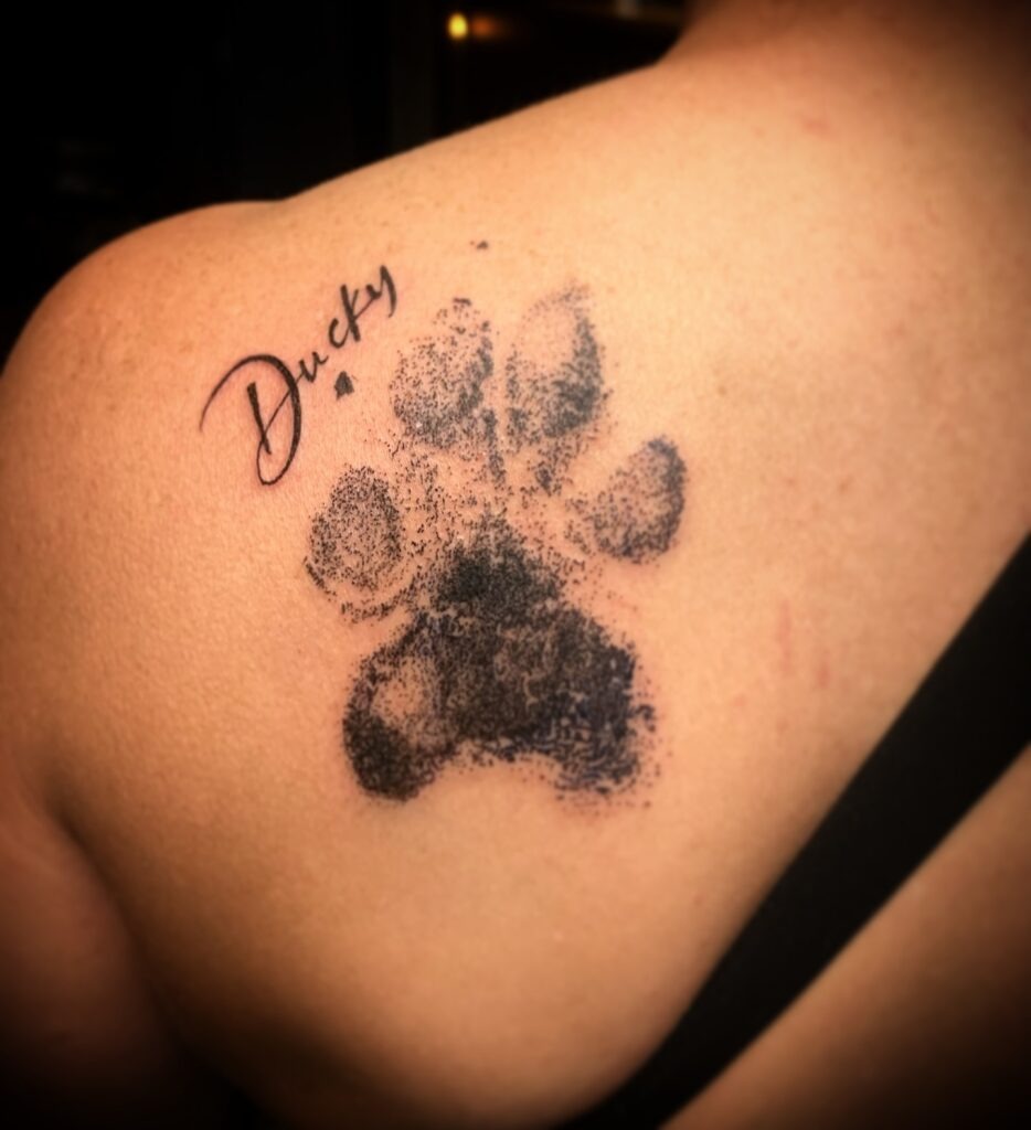 Textured Paw Print Tattoo with Name Tattoo Design