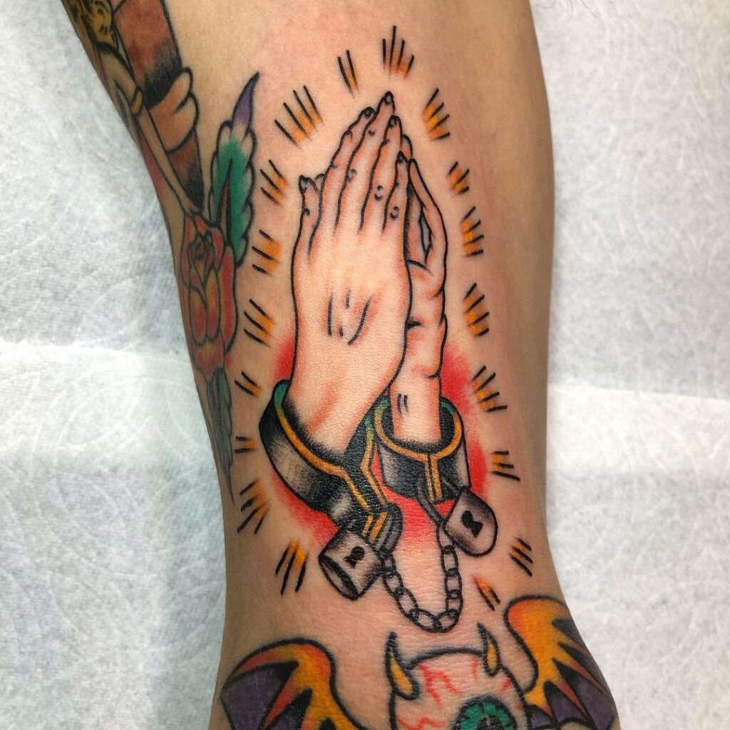 Bound Praying Hands Tattoo with Handcuffs Tattoo Design