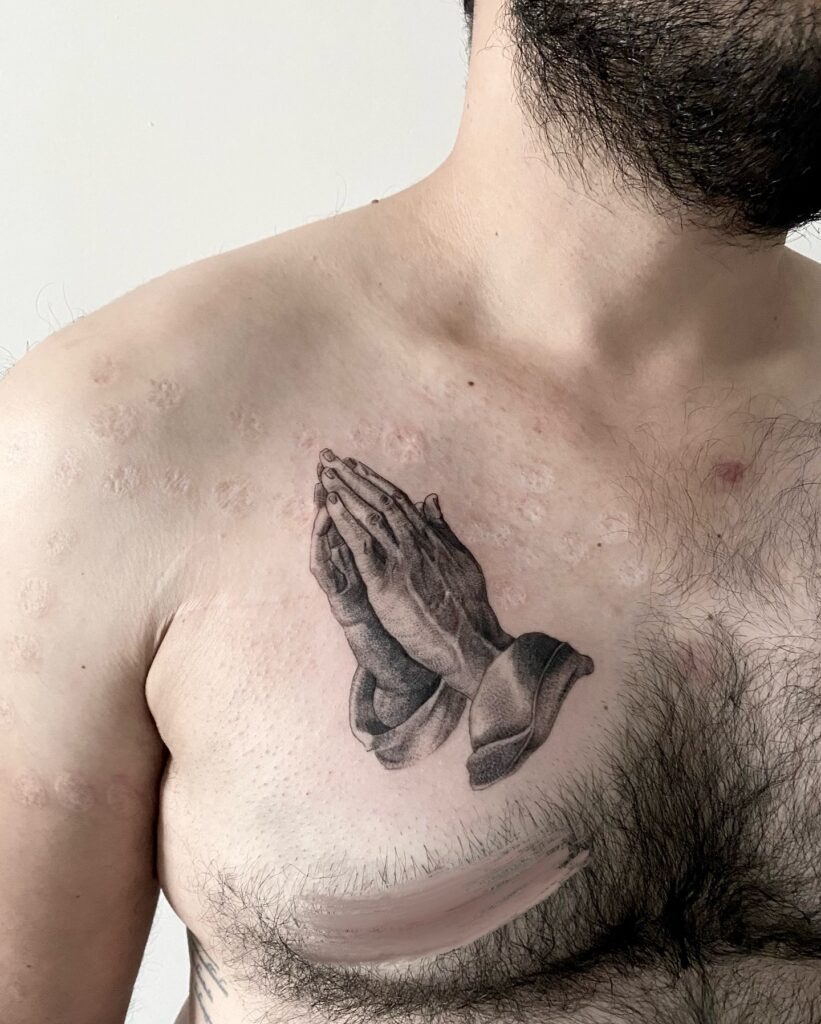 Minimalist Praying Hands Tattoo on Upper Arm Tattoo Design