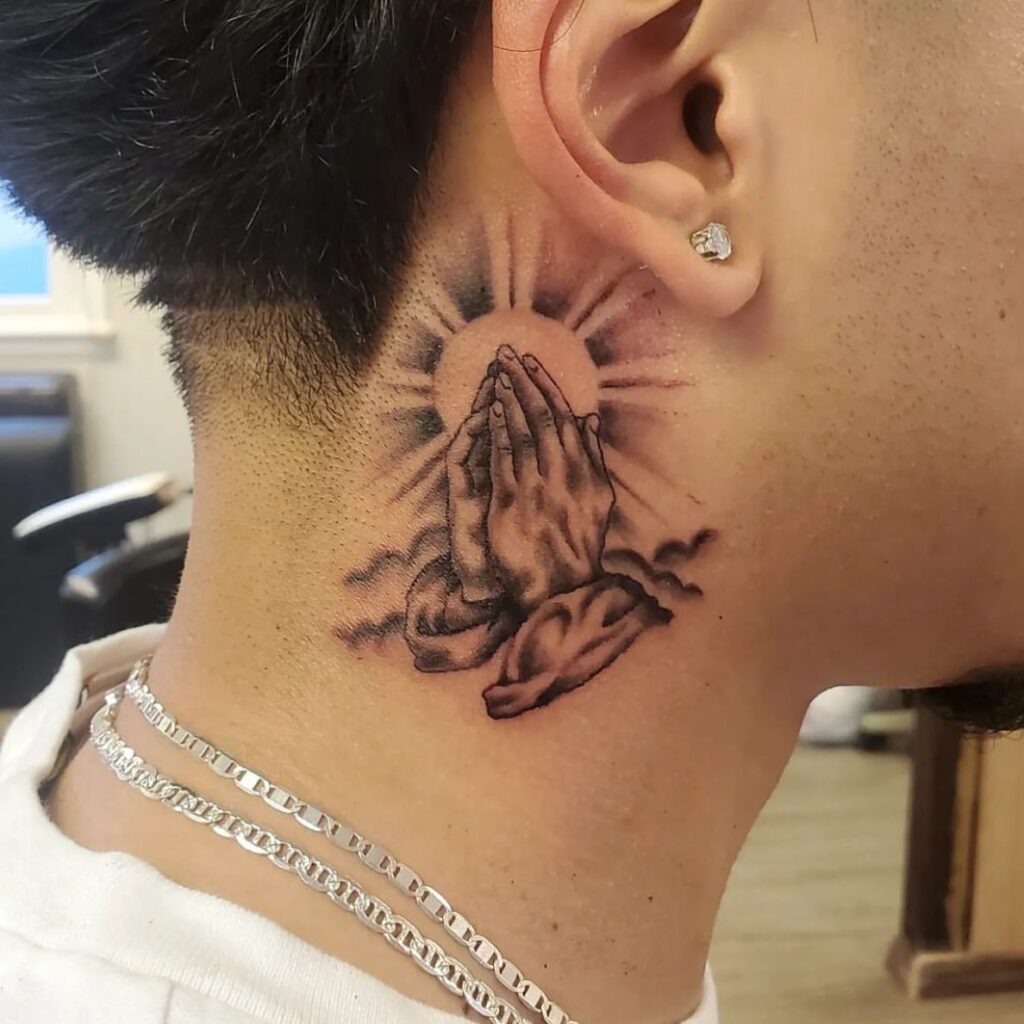 Neck Praying Hands with Sunburst and Clouds Tattoo Tattoo Design