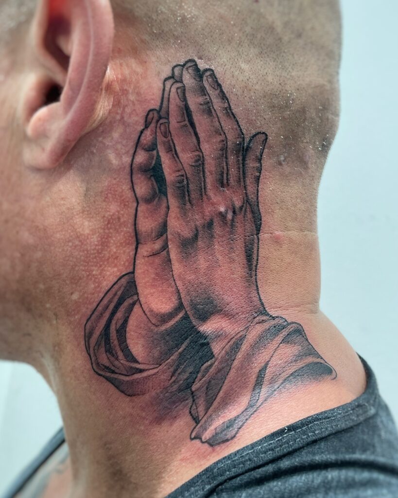 Praying Hands Tattoo with Tree and "Our People" Banner Tattoo Design