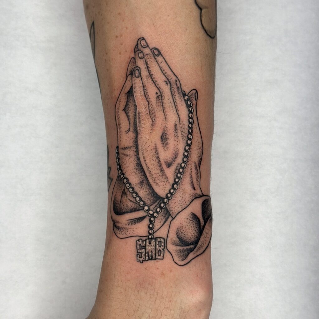 Praying Hands with Rosary and Family Script Chest Tattoo Tattoo Design
