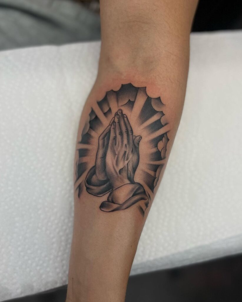Praying Hands with Rosary, Rose, and Radiant Light Forearm Tattoo Tattoo Design