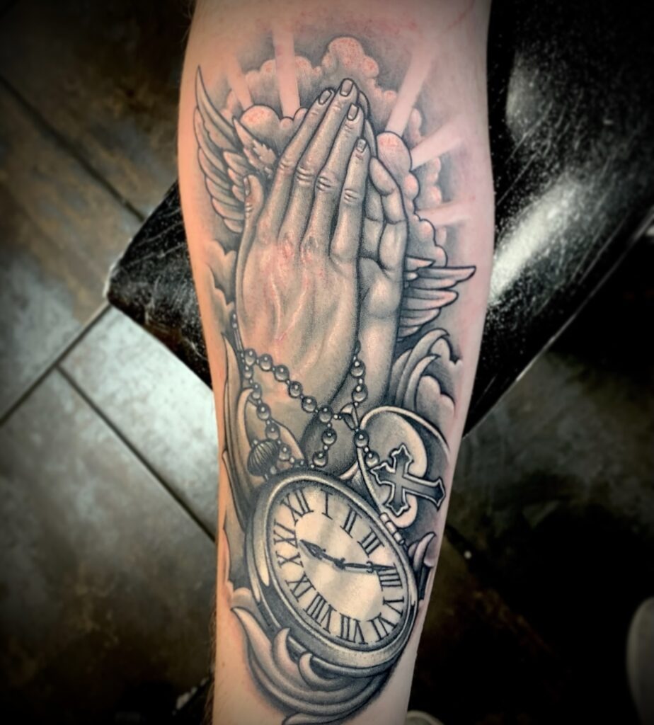 Radiant Praying Hands Forearm Tattoo Tattoo Design