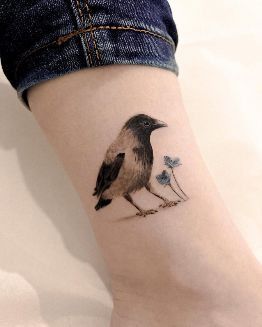 Beautifully shaded raven tattoo with delicate flowers Tattoo Design