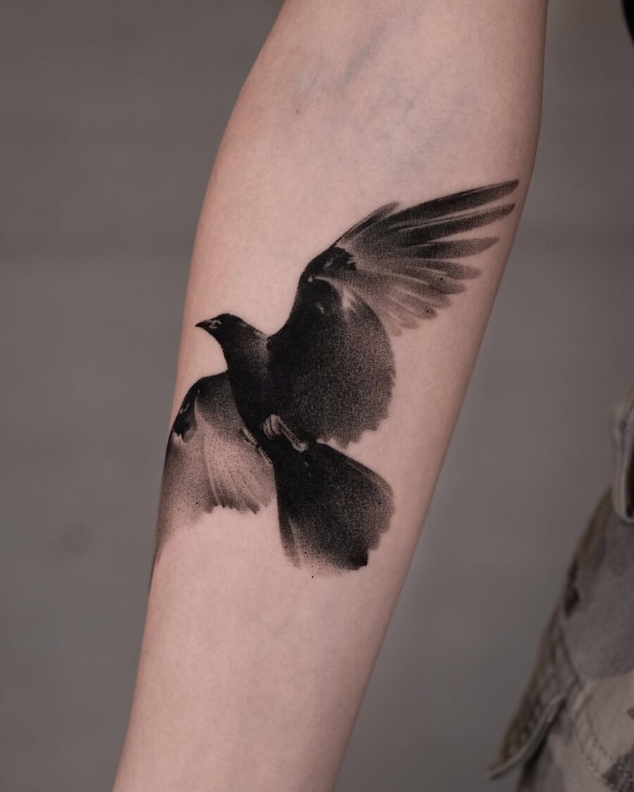 Elegant flying raven tattoo in black ink Tattoo Design