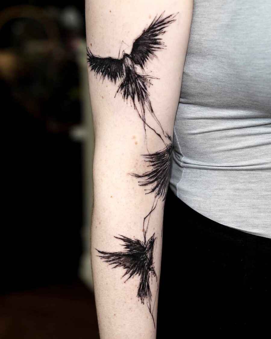 Elegant flying ravens in stunning black ink Tattoo Design