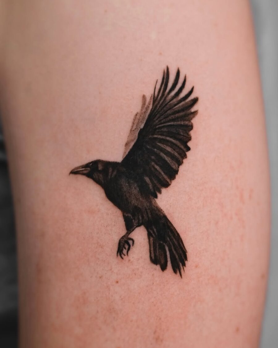 Elegant raven tattoo in mid-flight Tattoo Design
