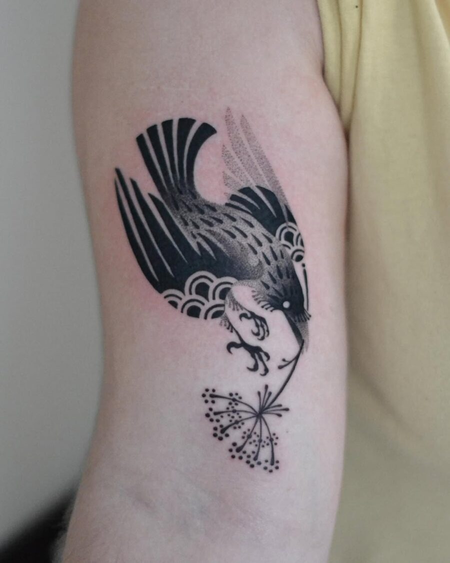 Elegant raven tattoo with floral elements Tattoo Design