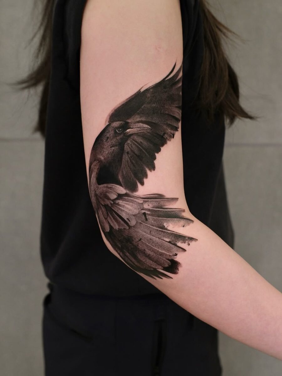 Elegant raven tattoo with intricate wing details Tattoo Design