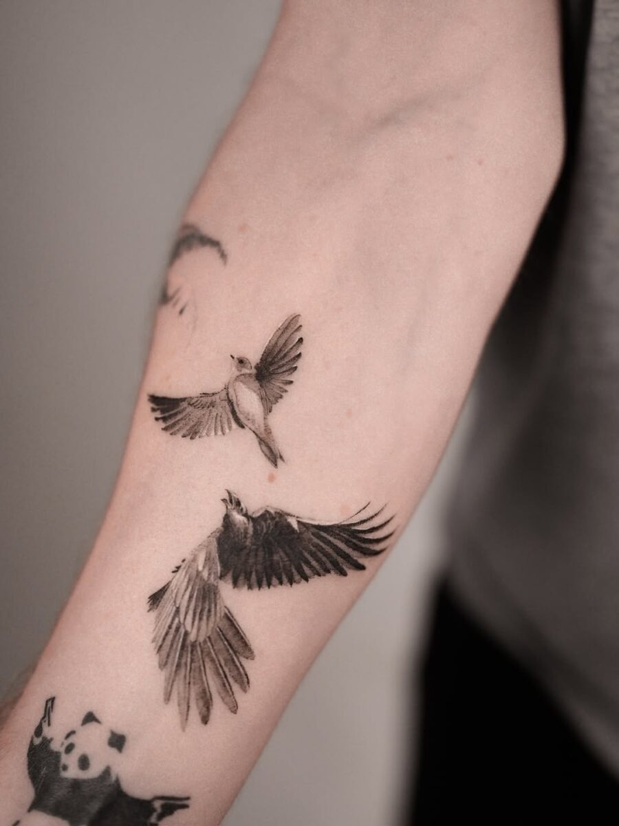Elegant raven tattoos embody freedom and mystery Tattoo Design