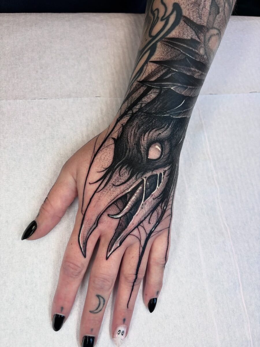 Intricate raven claw tattoo on the hand Tattoo Design