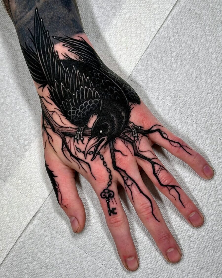 Intricate raven tattoo with key symbolism Tattoo Design