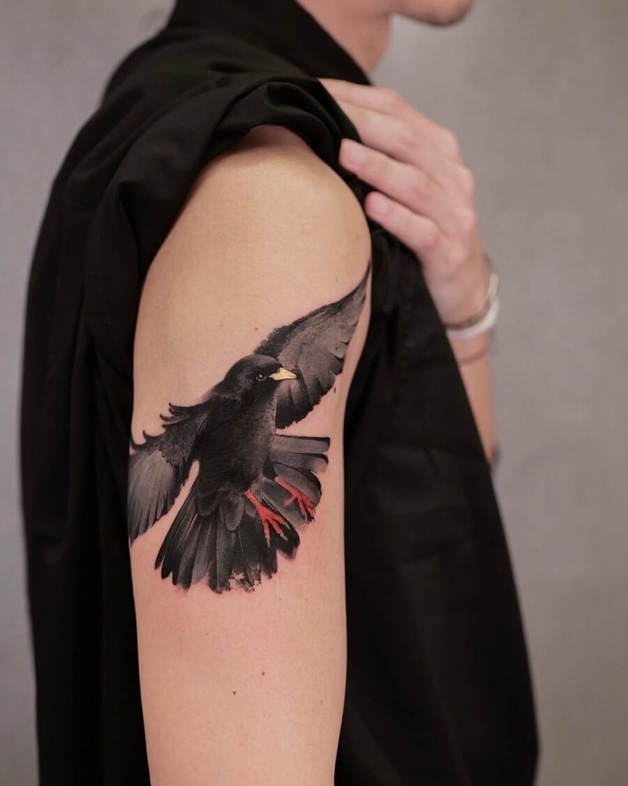 Realistic raven tattoo with striking colors. Tattoo Design
