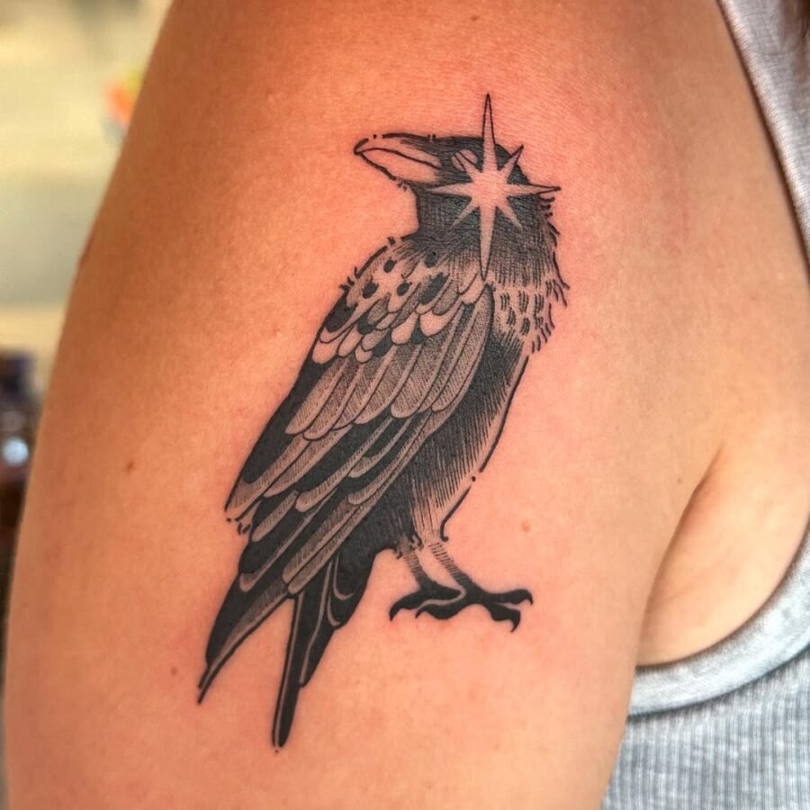 Striking Raven Tattoo with Star Accent Tattoo Design