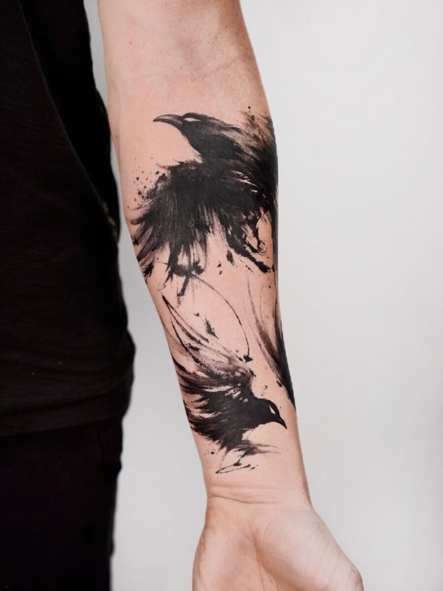 Stunning artistic raven tattoo with dynamic splashes Tattoo Design