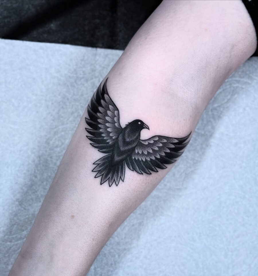 Stunning black raven tattoo in flight Tattoo Design