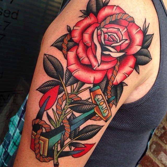 Bright Colored Rose Flower On A Guys Upper Arm Tattoo Design