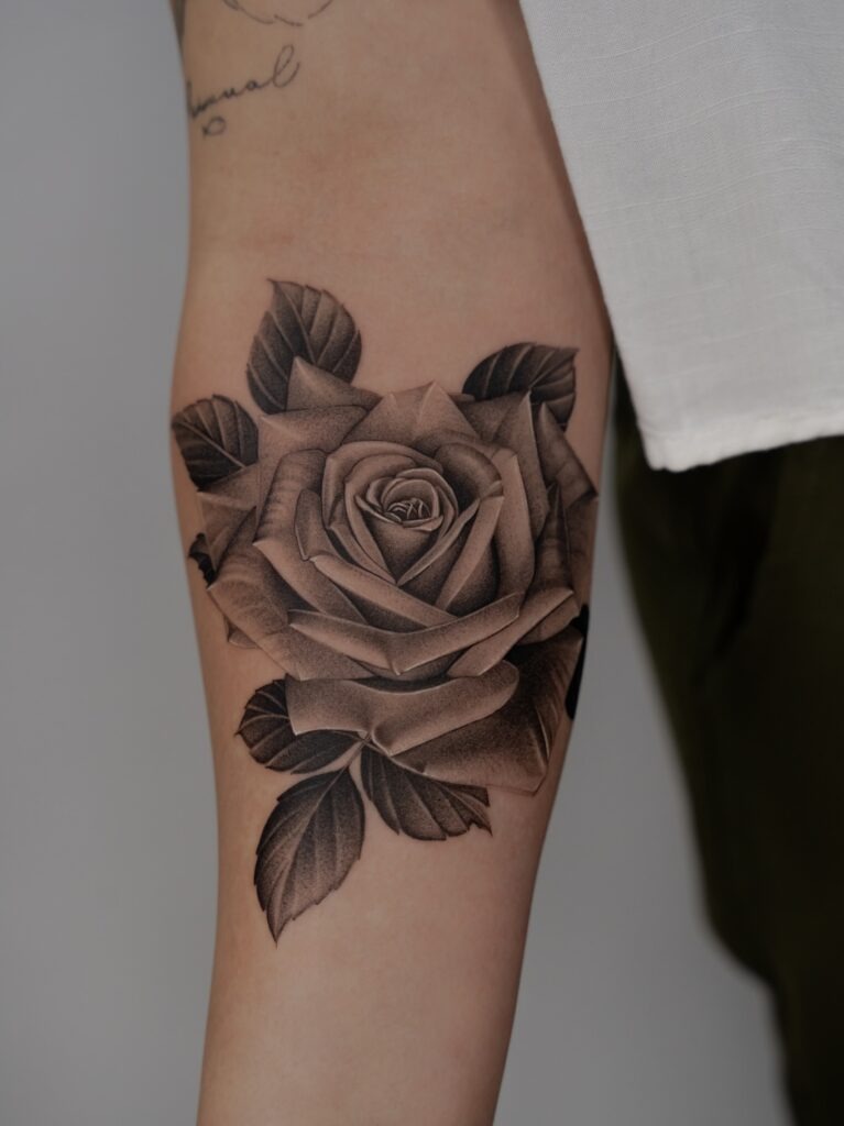 Black and Grey Realistic Rose Tattoo on Arm Tattoo Design