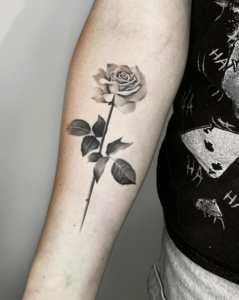 Black and Grey Realistic Rose Tattoo on Forearm Tattoo Design