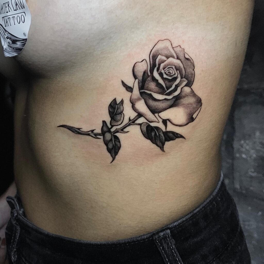 Black and Grey Underb**b Rose Tattoo Tattoo Design
