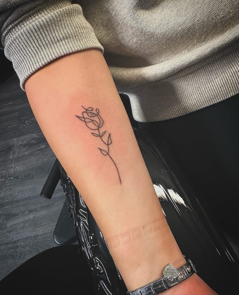 Minimalist One-Line Rose Tattoo on Forearm Tattoo Design