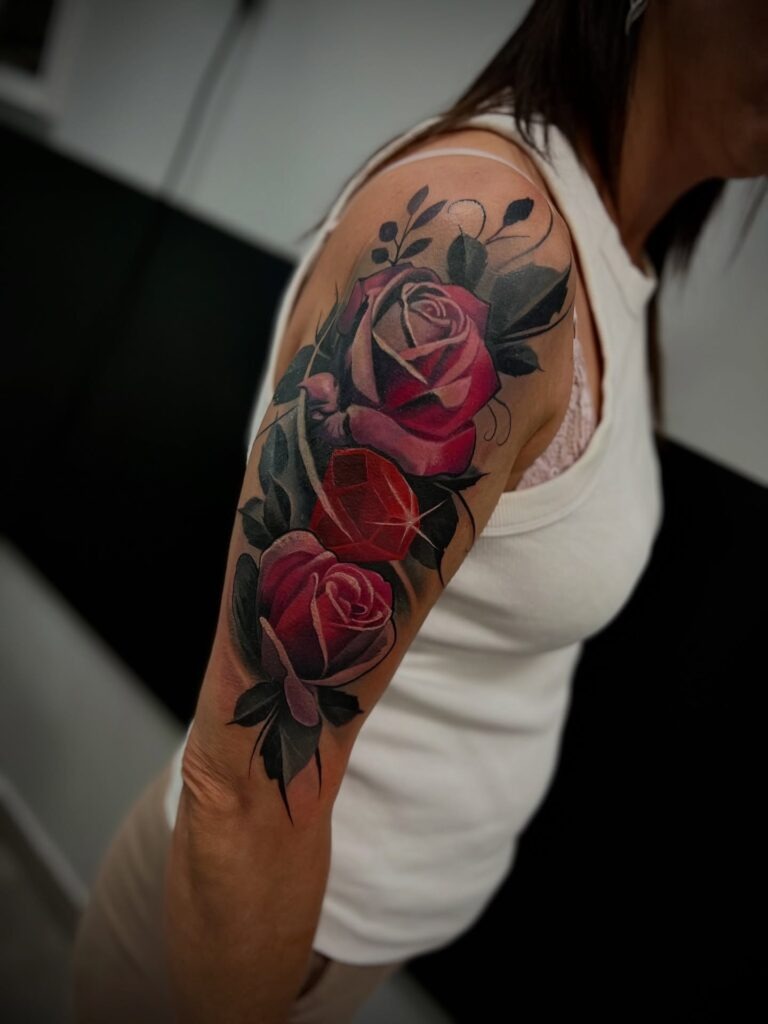 Realistic Red Rose Tattoo with Gem on Upper Arm Tattoo Design