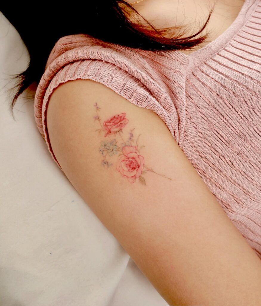 Soft Rose and Wildflower Tattoo on Upper Arm Tattoo Design