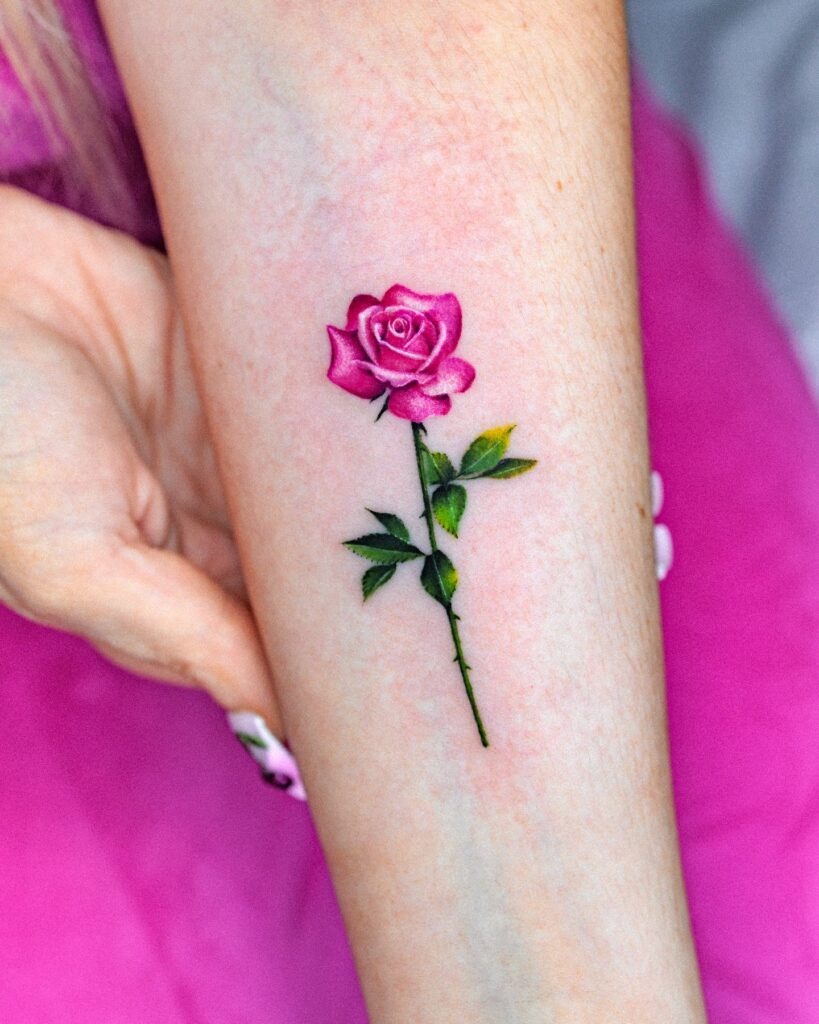 Vibrant Pink Rose Tattoo on Forearm Tattoo Design
