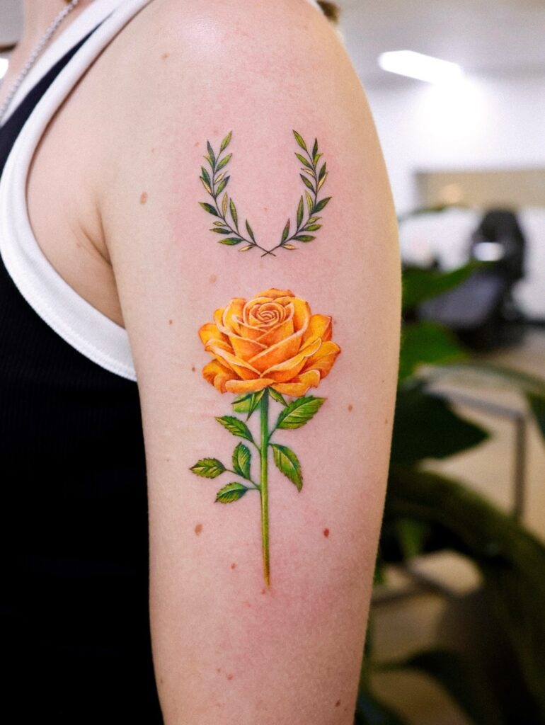 Yellow Rose and Laurel Wreath Tattoo on Upper Arm Tattoo Design