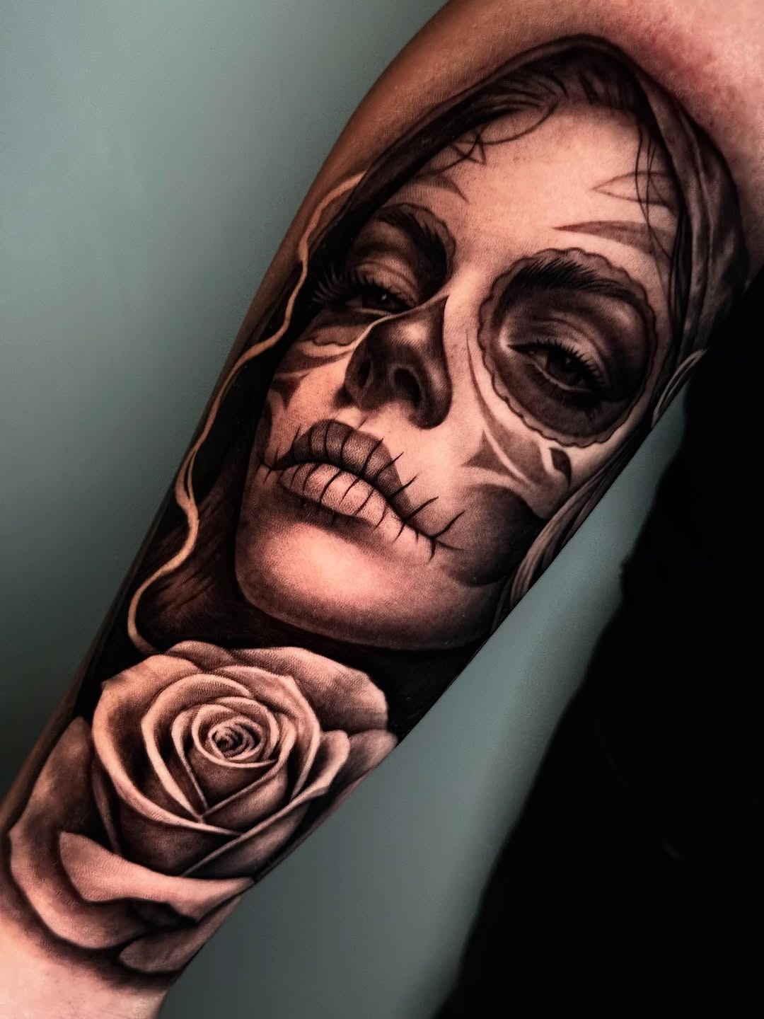 Intricate Santa Muerte tattoo with floral details Tattoo Design