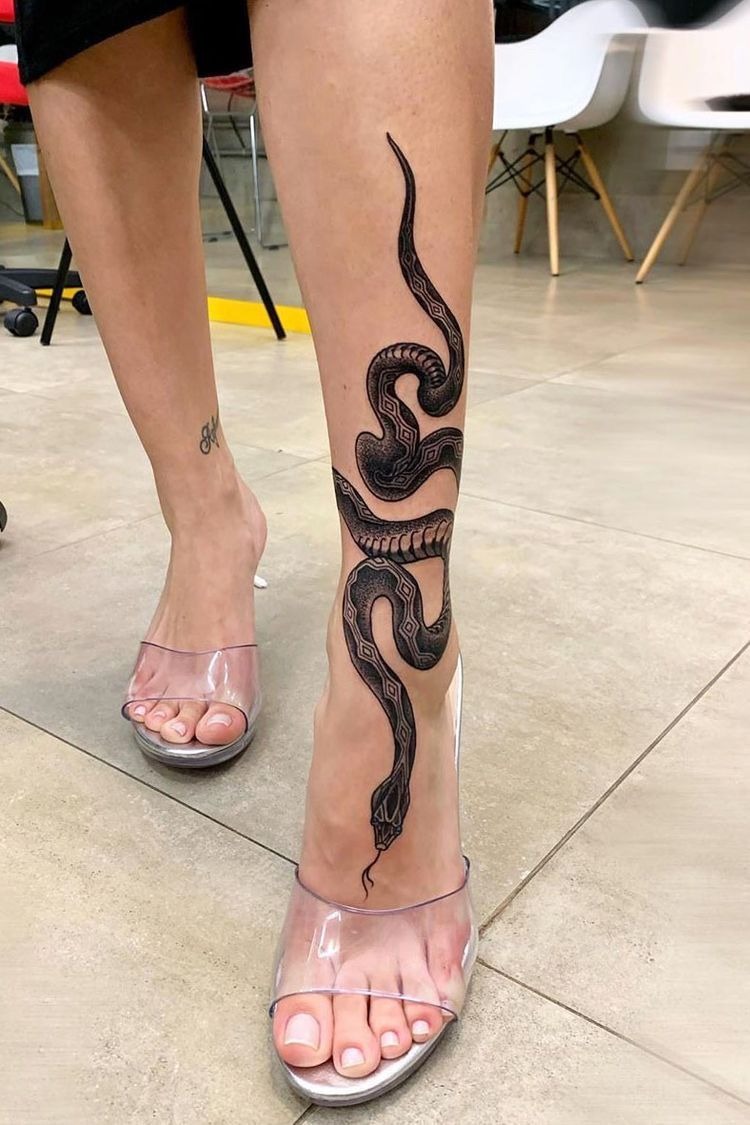 Sleek Black Snake Shin Tattoo Tattoo Design