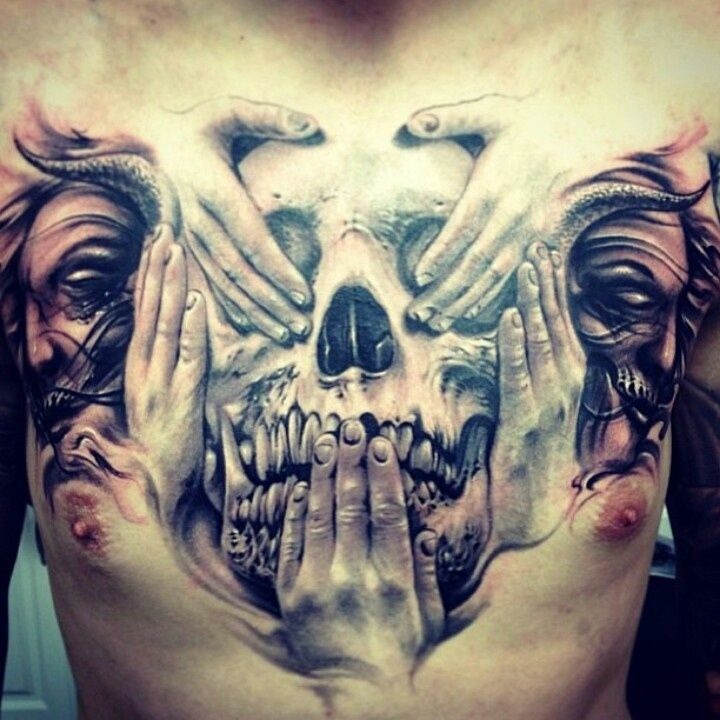 Awesome skull tattoo on guy’s chest Tattoo Design