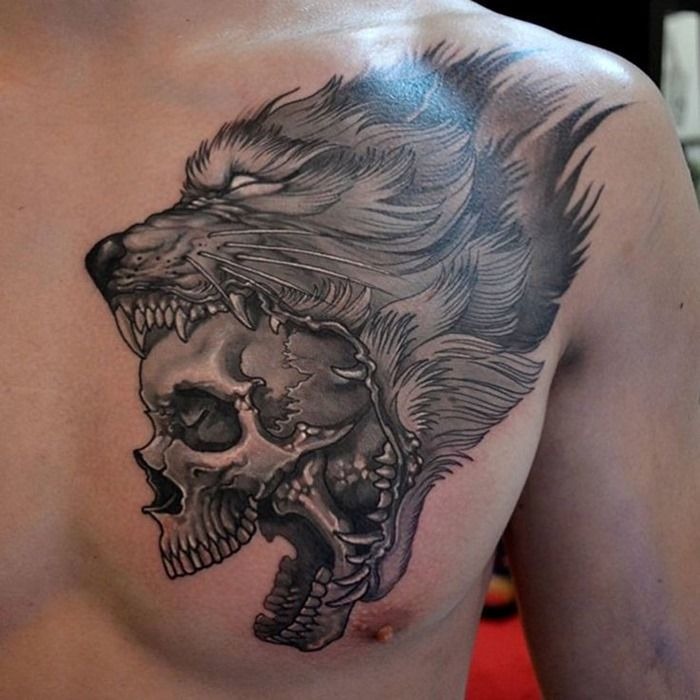 Awesome wolf skull tattoo on a guy’s breast Tattoo Design