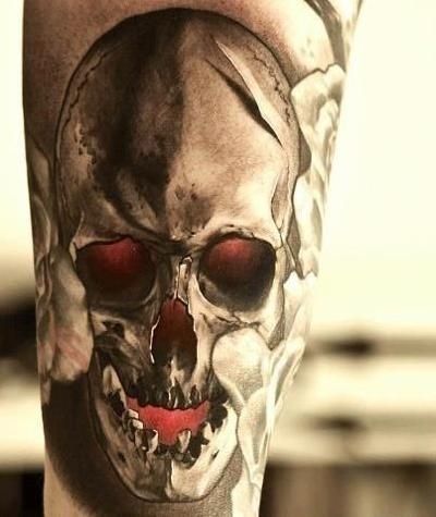 Cool human skull tattoo on a guy’s upper arm Tattoo Design
