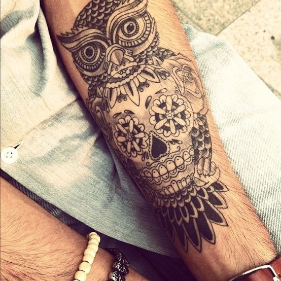 Cool tattoo with a skull on a guy’s arm Tattoo Design