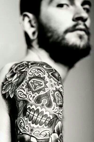 Cool tribal skull tattoo design on a man’s arm Tattoo Design