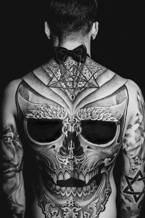 Epic skull tattoo on a guy’s back Tattoo Design