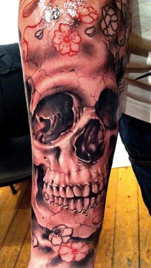 Flesh colored skull tattoo on leg Tattoo Design