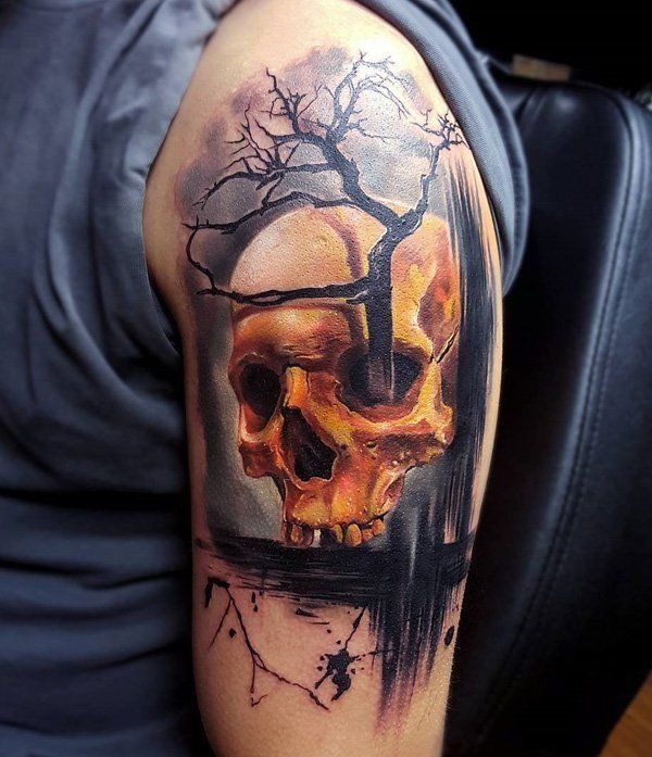 Golden skull and deadtree tattooon arm Tattoo Design