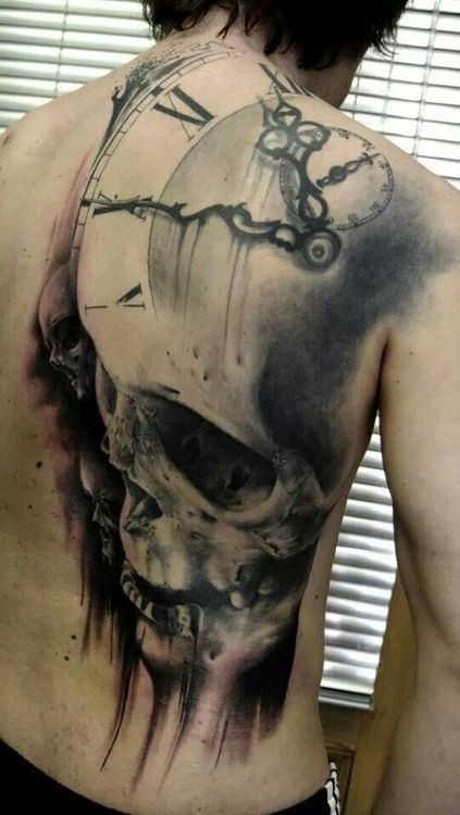 Large black and white skull tattoo on a guy’s back Tattoo Design